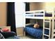 Well-lit bedroom featuring bunkbeds and window with dark curtains at 3039 Boating Blvd. Blvd, Kissimmee, FL 34746