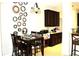Eat-in kitchen or dining space with dark wood table and chairs at 3039 Boating Blvd. Blvd, Kissimmee, FL 34746