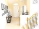 Inviting foyer with tile flooring and staircase at 3039 Boating Blvd. Blvd, Kissimmee, FL 34746