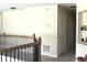 Hallway featuring wood railing and trim, and doors leading to rooms at 3039 Boating Blvd. Blvd, Kissimmee, FL 34746