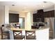 Modern kitchen featuring stainless steel appliances and a breakfast bar at 3039 Boating Blvd. Blvd, Kissimmee, FL 34746