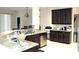 Spacious kitchen with granite countertops and dark wood cabinets at 3039 Boating Blvd. Blvd, Kissimmee, FL 34746