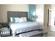 Spacious main bedroom with a plush bed, matching storage bench, and ample natural light at 3039 Boating Blvd. Blvd, Kissimmee, FL 34746