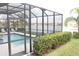 Relaxing screened-in pool area overlooking the serene lake at 3039 Boating Blvd. Blvd, Kissimmee, FL 34746