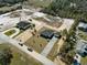 Aerial view showcasing a home with a detached garage, long driveway, and newly installed landscaping at 31905 Larkspur Ave, Eustis, FL 32736