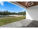 Backyard patio featuring brick pavers with views of the green outdoor space, ideal for relaxation and enjoyment at 31905 Larkspur Ave, Eustis, FL 32736