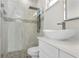 Stylish bathroom with a frameless glass shower, rain showerhead, and a vessel sink on a white vanity at 31905 Larkspur Ave, Eustis, FL 32736