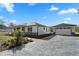 Charming single-story home featuring a separate garage and beautifully paved driveway at 31905 Larkspur Ave, Eustis, FL 32736