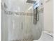 Modern shower with glass enclosure, rainfall showerhead, and stylish mosaic tile accents for a luxurious feel at 31905 Larkspur Ave, Eustis, FL 32736
