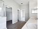 Bright bathroom with double sink vanity, walk-in shower and a large closet at 332 Lake Doe Blvd, Apopka, FL 32703
