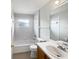 Bright bathroom with a tub, toilet, and vanity at 332 Lake Doe Blvd, Apopka, FL 32703