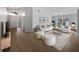 Bright living room with vaulted ceiling, wood flooring, neutral color palette, and ample natural light at 332 Lake Doe Blvd, Apopka, FL 32703