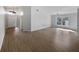 Spacious living room with vaulted ceiling, wood flooring, and large window at 332 Lake Doe Blvd, Apopka, FL 32703