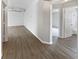 Spacious living room featuring gray walls, base trim, and wood flooring at 332 Lake Doe Blvd, Apopka, FL 32703