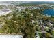 Aerial view of the property showcasing the neighborhood and the nearby lake and city skyline at 342 Oak Estates Dr, Orlando, FL 32806