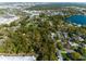 Aerial view of the land lines showcasing neighborhood, nearby lake and city skyline at 342 Oak Estates Dr, Orlando, FL 32806
