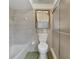 Tiled bathroom featuring a bathtub, toilet, and glass-door shower at 342 Oak Estates Dr, Orlando, FL 32806