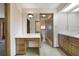 Bathroom area featuring a vanity, large mirror, and doorway to a shower at 342 Oak Estates Dr, Orlando, FL 32806