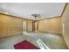 Large bedroom with ceiling fan, wood trim, and access to multiple rooms at 342 Oak Estates Dr, Orlando, FL 32806