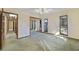 Bright bedroom featuring large windows, ceiling fan, and mirrored closet doors at 342 Oak Estates Dr, Orlando, FL 32806
