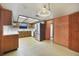Bright kitchen with stainless steel refrigerator, oak cabinets, and a view to the breakfast area at 342 Oak Estates Dr, Orlando, FL 32806