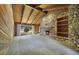 Spacious living room with vaulted wood ceilings, stone fireplace, and large windows at 342 Oak Estates Dr, Orlando, FL 32806