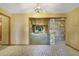 Open living area featuring tile flooring, stone walls, and access to the backyard at 342 Oak Estates Dr, Orlando, FL 32806