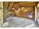 Open living room with vaulted wood ceilings, stone fireplace, and backyard access at 342 Oak Estates Dr, Orlando, FL 32806