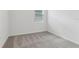 Bedroom with carpet flooring and bright window at 3876 Giorgio Dr, Winter Haven, FL 33884