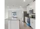 Kitchen view with stainless steel appliances, granite countertops, and an island at 3876 Giorgio Dr, Winter Haven, FL 33884