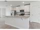 Kitchen features granite countertops, stainless steel appliances, and a center island at 3876 Giorgio Dr, Winter Haven, FL 33884