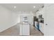 Bright kitchen with granite countertops, stainless steel appliances, and an island at 3876 Giorgio Dr, Winter Haven, FL 33884