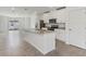 Kitchen features an island, stainless steel appliances, and an open floor plan at 3876 Giorgio Dr, Winter Haven, FL 33884
