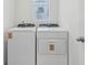 Bright laundry room with newer washer and dryer units at 3876 Giorgio Dr, Winter Haven, FL 33884