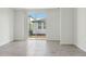 Bright living room with gray tiled floors and sliding glass doors at 3876 Giorgio Dr, Winter Haven, FL 33884