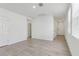 Spacious living room featuring gray tiled floor and multiple doors for easy access at 3876 Giorgio Dr, Winter Haven, FL 33884