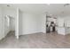 Open-concept living space showcases a kitchen with stainless steel appliances at 3876 Giorgio Dr, Winter Haven, FL 33884