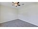 Neutral bedroom featuring new carpet, a ceiling fan, and ample natural light at 39 Hickory Course Way, Ocala, FL 34472