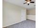 Bedroom with neutral walls, carpeted floor, ceiling fan, and window at 39 Hickory Course Way, Ocala, FL 34472