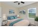 Serene bedroom showcasing a queen bed with a window view and neutral décor at 39 Hickory Course Way, Ocala, FL 34472