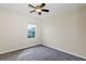 Bedroom with neutral walls, carpeted floor, ceiling fan, and window at 39 Hickory Course Way, Ocala, FL 34472