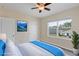 Bright bedroom with ample natural light, a queen bed, and modern, neutral finishes at 39 Hickory Course Way, Ocala, FL 34472