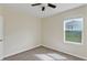 This cozy bedroom features carpeted flooring and a window allowing natural light to illuminate the room at 39 Hickory Course Way, Ocala, FL 34472