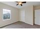 Bedroom with neutral walls, carpeted floor, ceiling fan, and window at 39 Hickory Course Way, Ocala, FL 34472