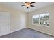 Bedroom featuring a window with view and two doors at 39 Hickory Course Way, Ocala, FL 34472