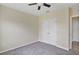 Comfortable bedroom with ceiling fan and closet, providing a relaxing and private retreat at 39 Hickory Course Way, Ocala, FL 34472
