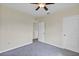 Bedroom with neutral walls, carpeted floor, ceiling fan, and window at 39 Hickory Course Way, Ocala, FL 34472