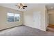 Bedroom with neutral walls, carpeted floor, ceiling fan, and window at 39 Hickory Course Way, Ocala, FL 34472