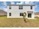 Exterior of home featuring sliding glass door and yard at 39 Hickory Course Way, Ocala, FL 34472