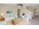Cozy living room with neutral decor, plush seating, and a natural fiber rug at 39 Hickory Course Way, Ocala, FL 34472